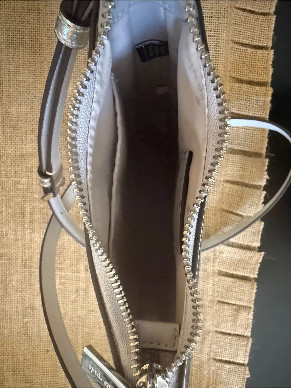 Kate Spade Kayla Small Swingpack Metallic Silver Leather Crossbody Bag. NWOT.